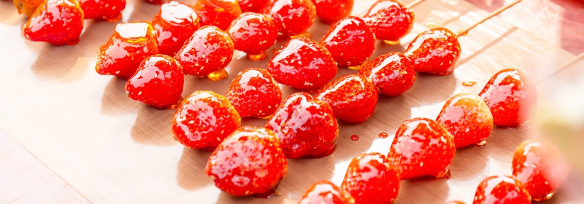 Tanghulu Strawberry candies coated in clear and crispy sugar glaze, Candy strawberry sweet